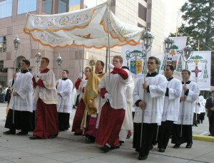 Figure: The Eucharist is carried in procession for worship.
